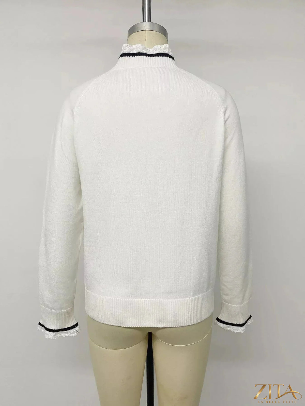 Zita La Belle Elite lace trim sweater with bow embellishments, featuring intricate lace details on a stylish knit sweater.
