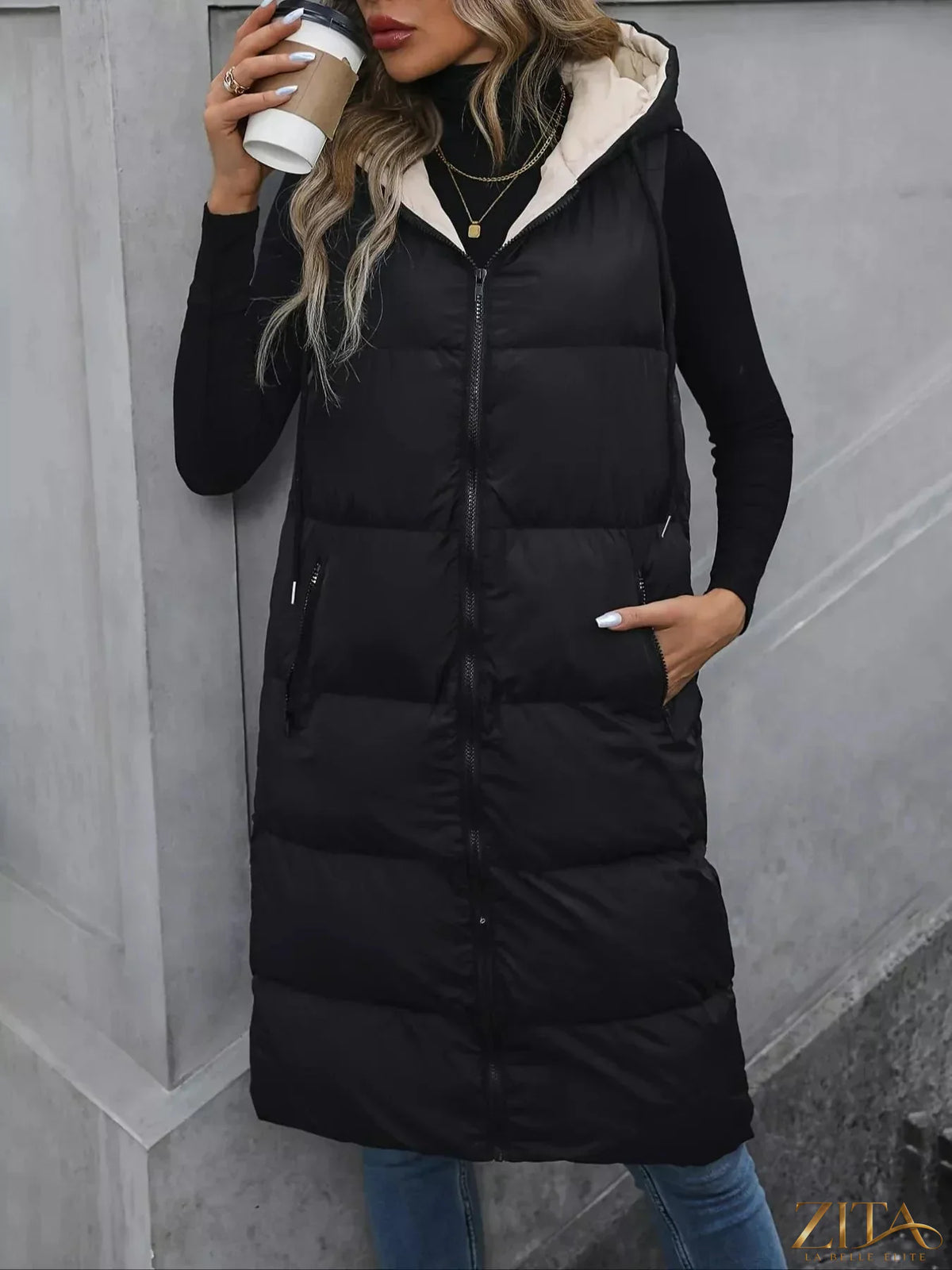 Zita La Belle Elite longline padded hooded vest coat with quilted design and front pockets, perfect for cold weather.