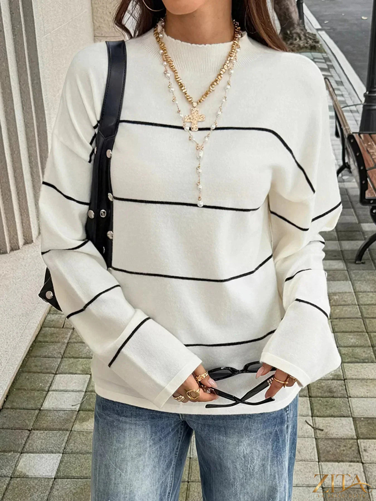 Zita La Belle Elite striped mock neck sweater featuring horizontal black and white stripes, long sleeves, and cozy knit fabric.