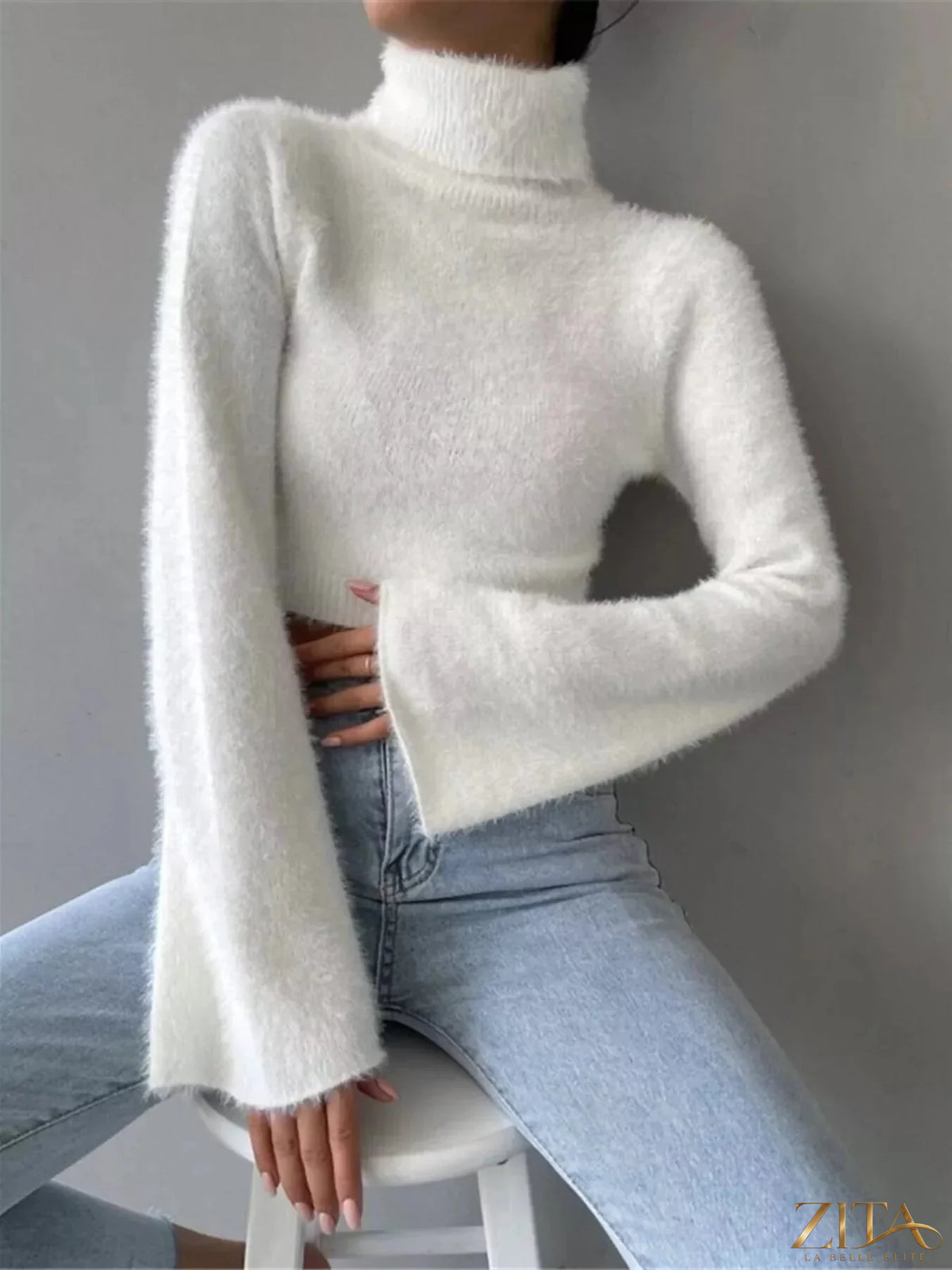 Cream turtleneck flare sleeve sweater from Trendsi, featuring a cozy fit and stylish flared sleeves.