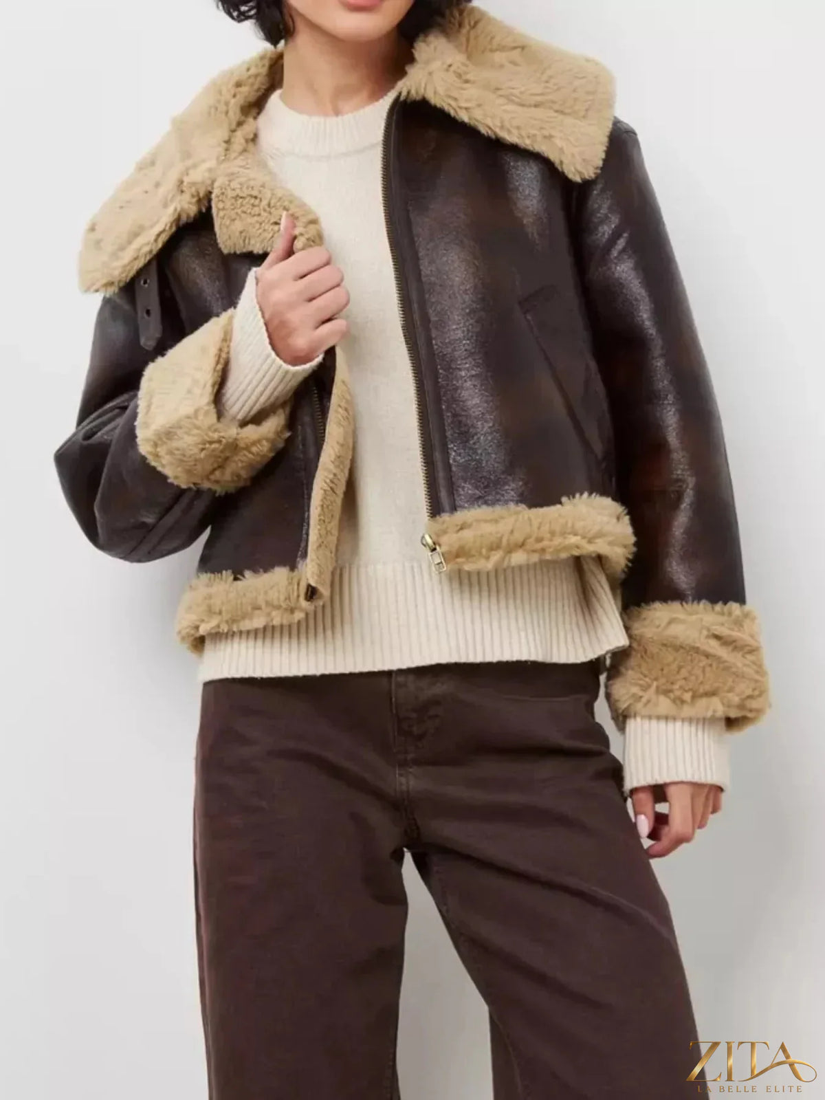 Vintage-inspired faux leather aviator jacket by Zita La Belle Elite with plush shearling trim and classic aviator style.