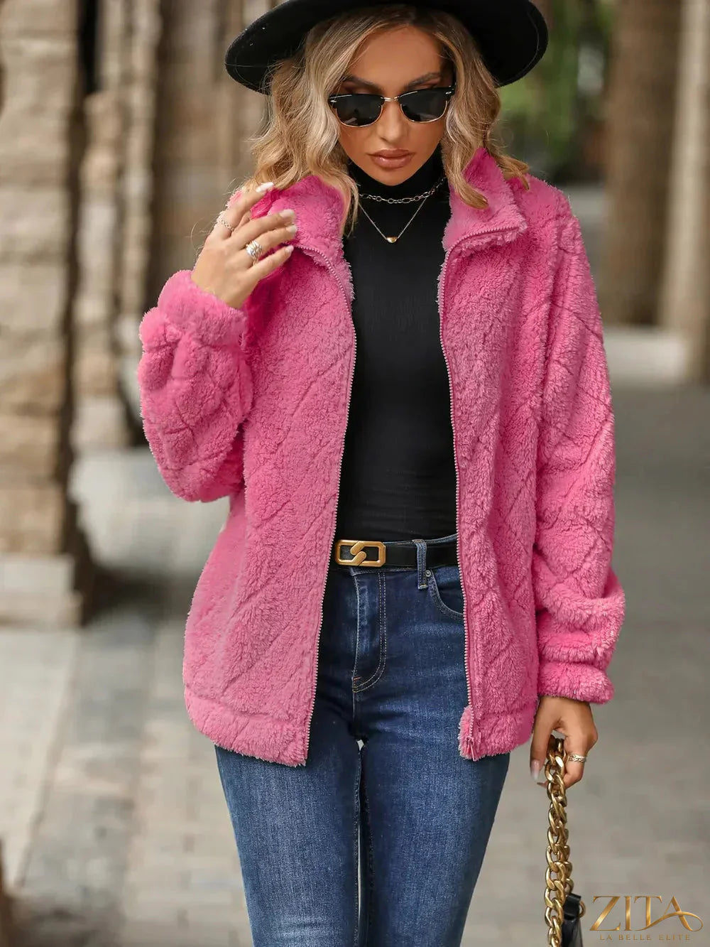 Zita La Belle Elite fuzzy pocketed zip-up jacket in soft fabric with front pockets and a full zipper, displayed on a hanger.