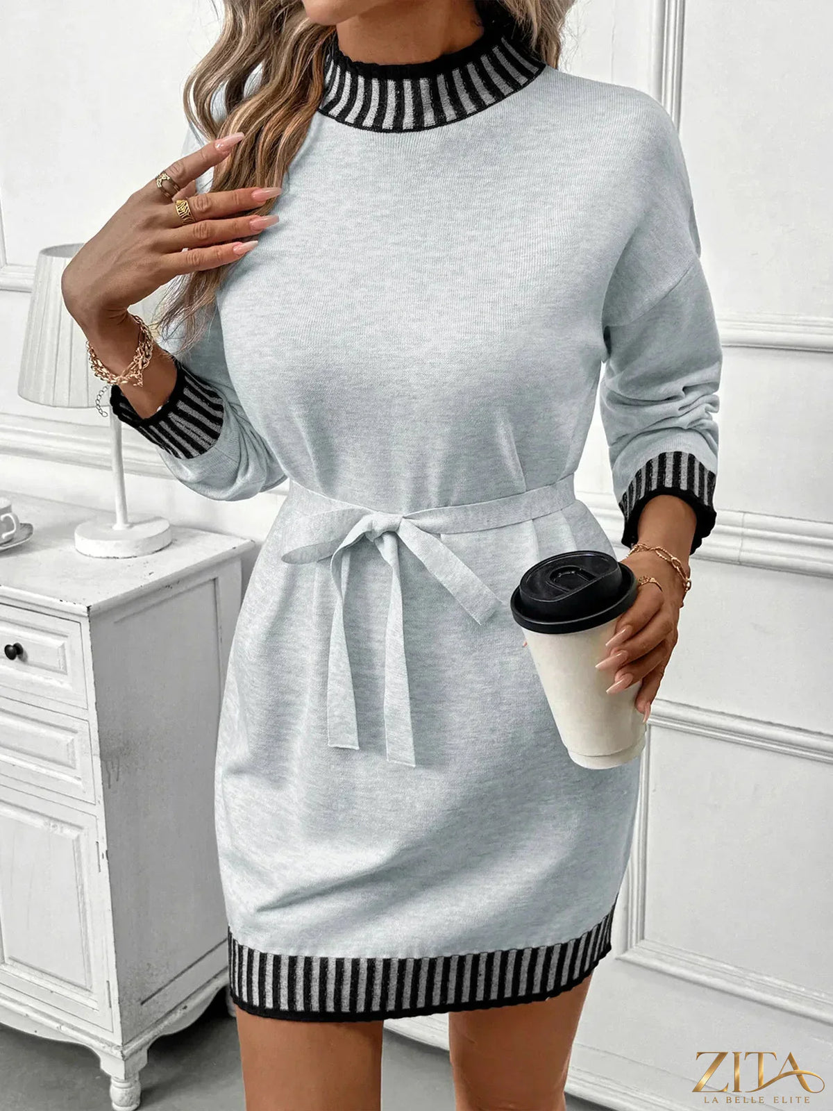 Zita La Belle Elite striped trim tie waist sweater dress displayed on a mannequin, featuring a fitted silhouette and stylish design.