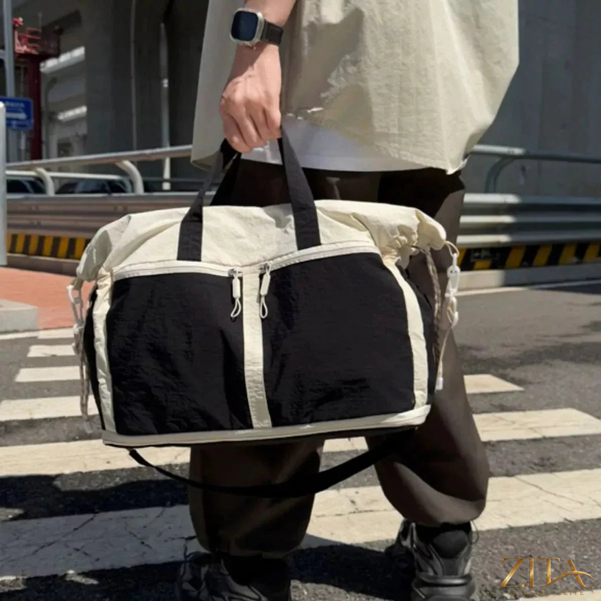 Color block travel bag by Zita La Belle Elite with multiple compartments and adjustable straps for easy travel.