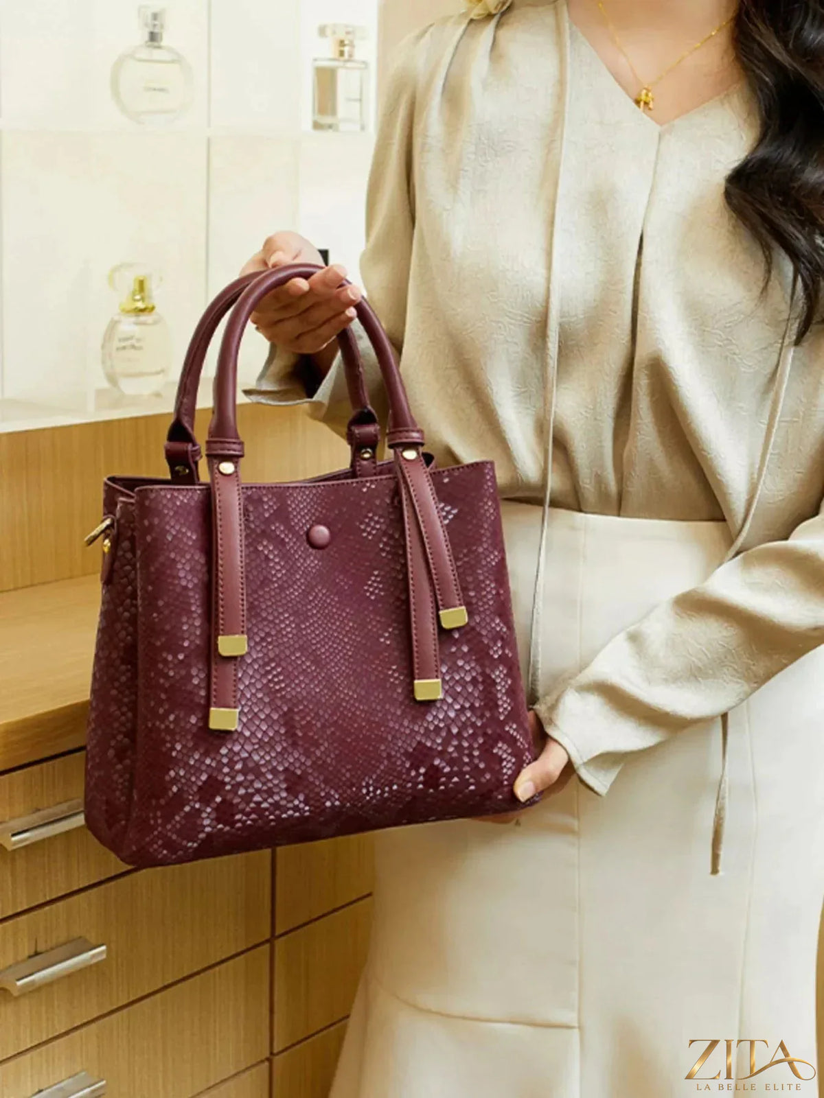 Zita La Belle Elite snakeskin pattern handbag with sleek design and textured surface, featuring a stylish clutch style.