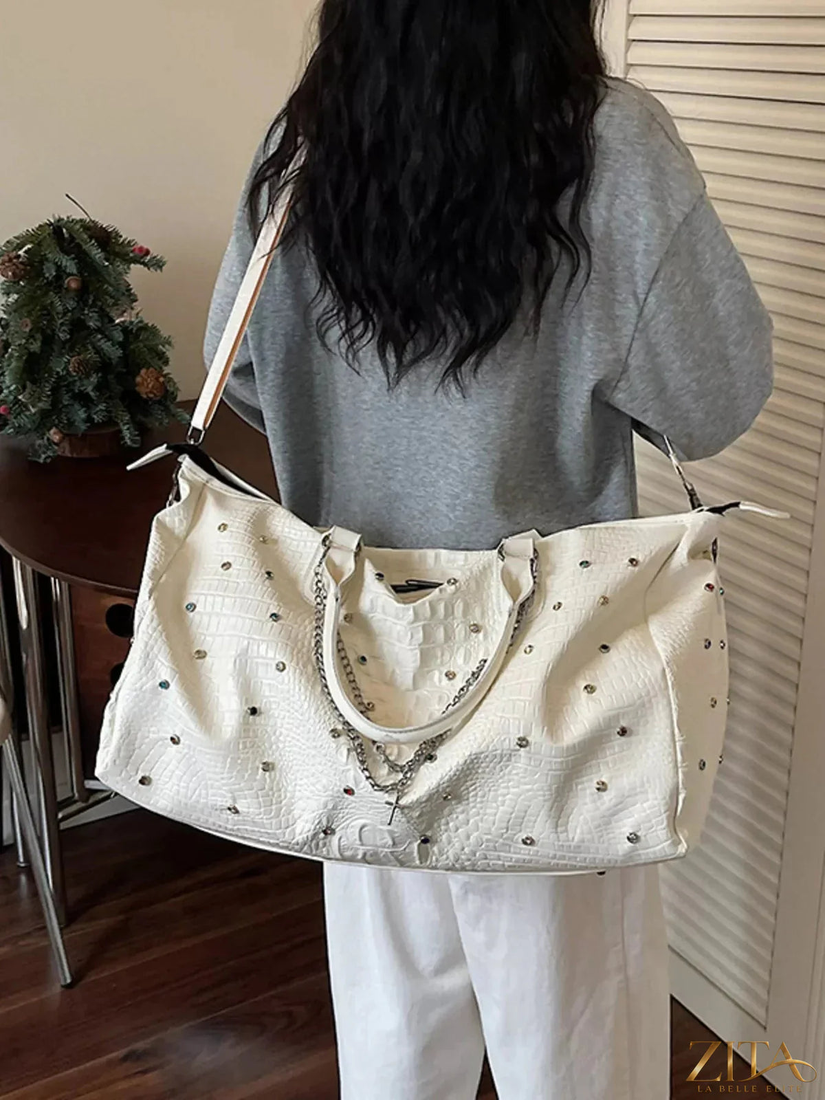 Large capacity travel bag by Zita La Belle Elite featuring studded design, durable fabric, and multiple compartments for travel convenience.