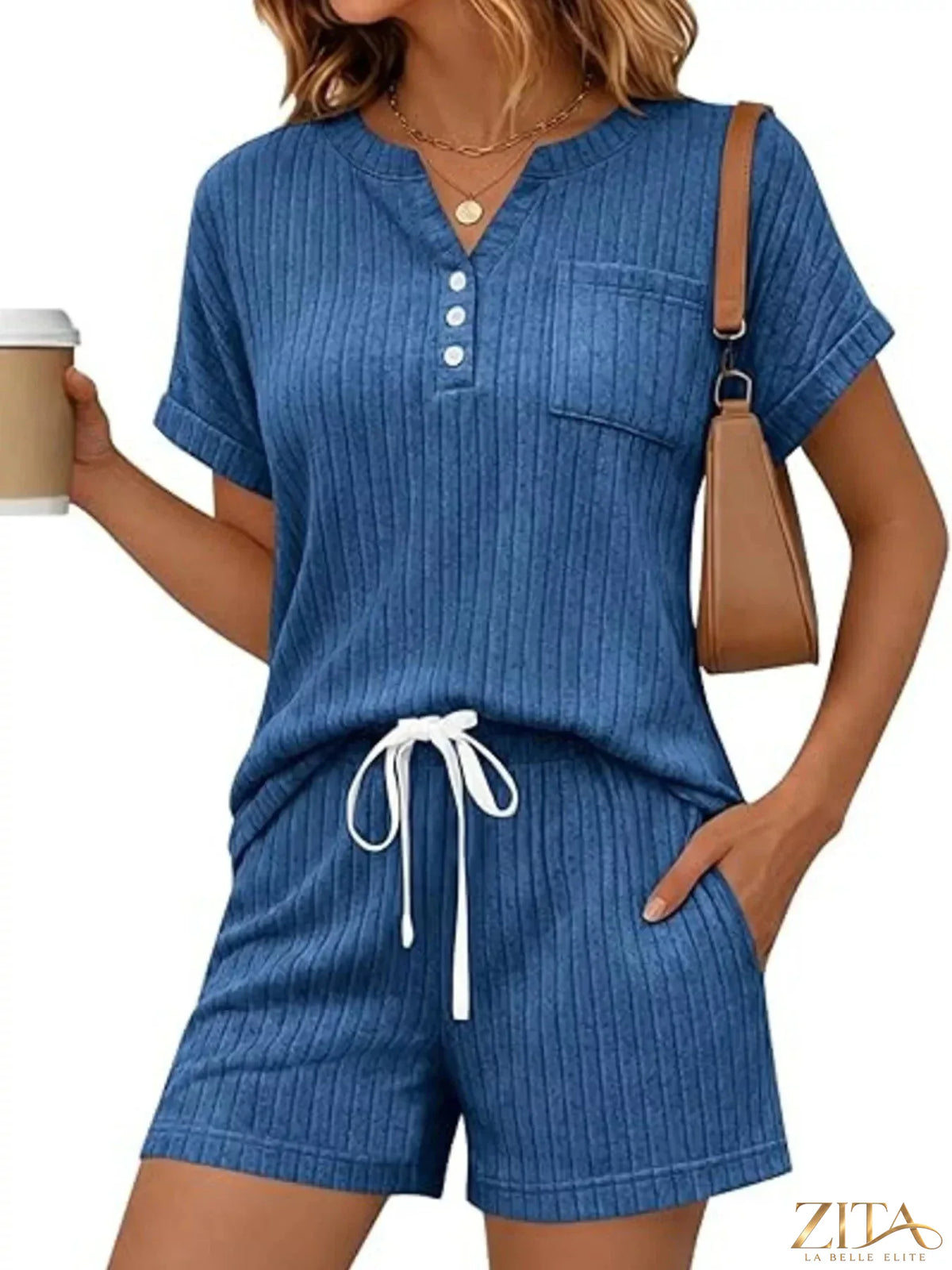 Casual ribbed knit tee and shorts set by Trendsi featuring a comfortable, stylish matching top and bottom in a ribbed fabric.