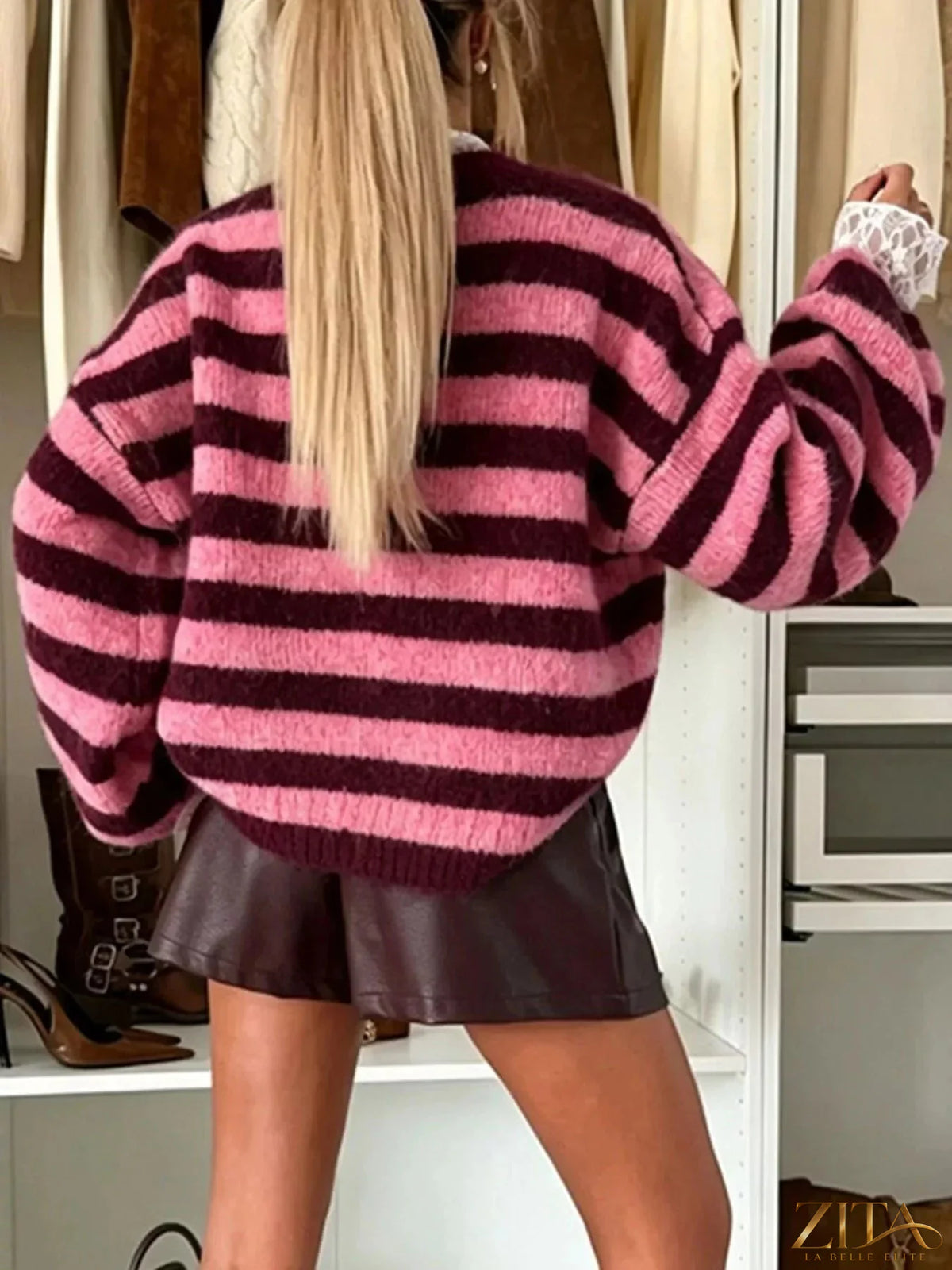Striped dropped shoulder sweater by Trendsi featuring a cozy knit design and relaxed fit, perfect for casual wear.