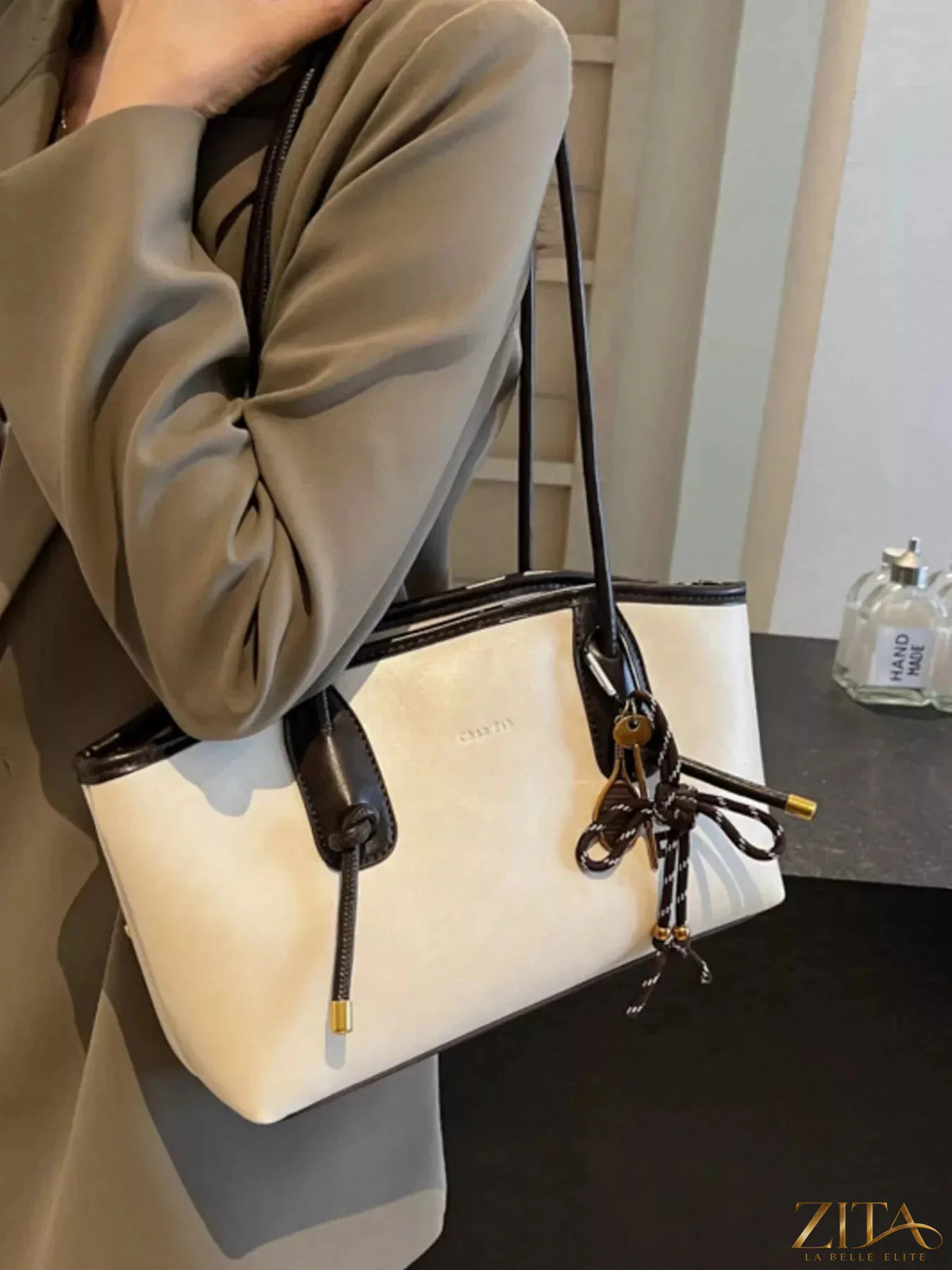 Two-tone Zita La Belle Elite shoulder bag with adjustable strap and silver hardware, stylish and versatile accessory.