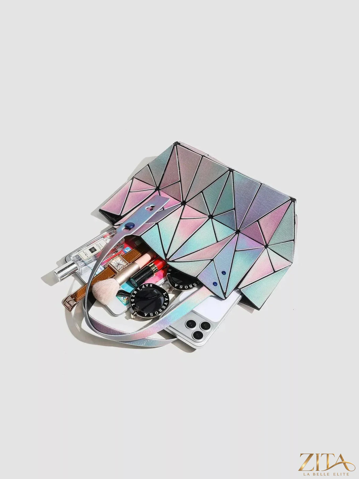 Iridescent geometric shoulder bag with a sleek design, featuring a metallic finish and compact shape by Zita La Belle Elite.