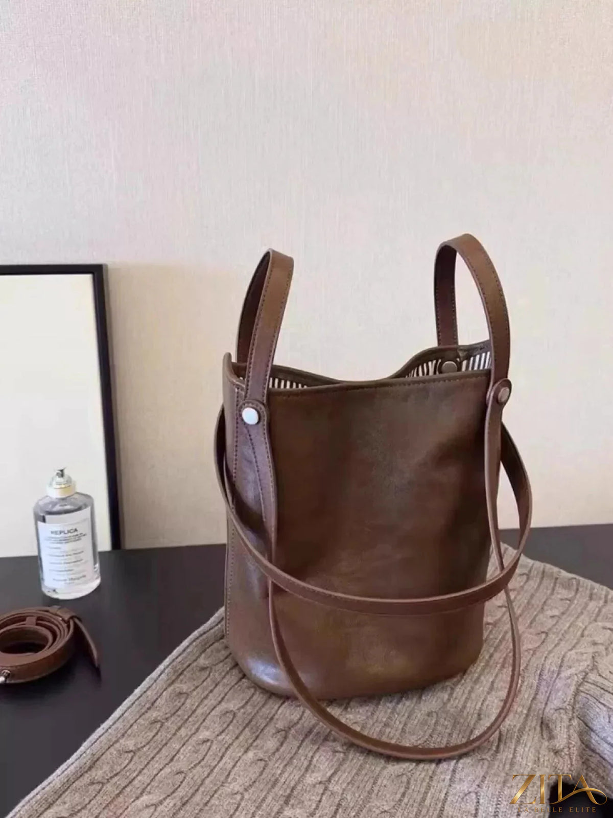 Zita La Belle Elite leather bucket tote bag with sturdy handle and spacious interior, made from high-quality brown leather.