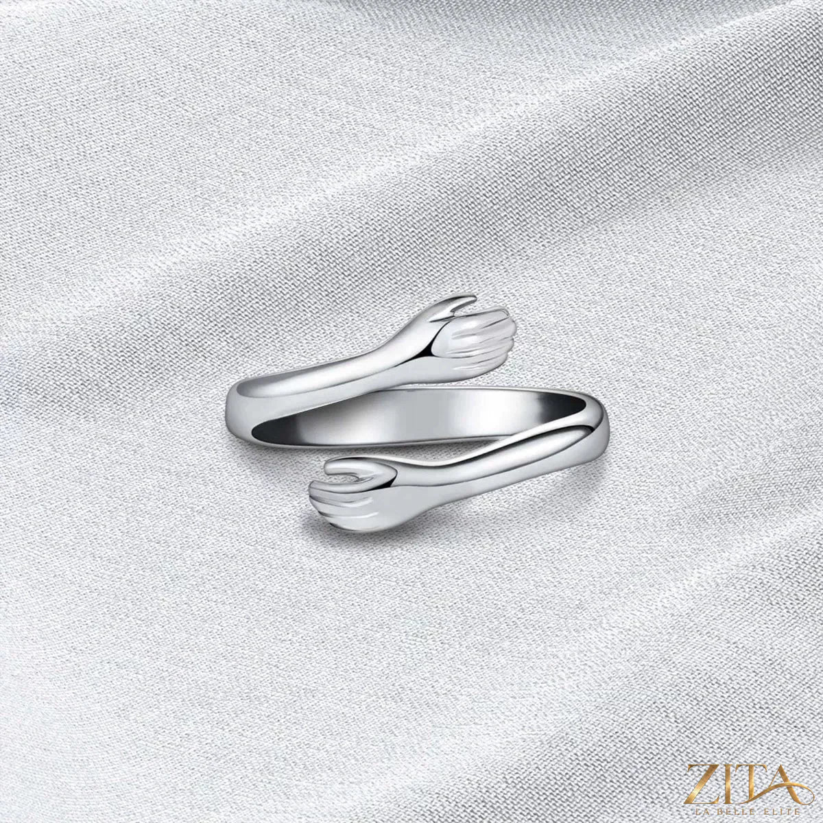 Sterling silver hug bypass ring by Zita La Belle Elite with a sleek, modern design and smooth, polished finish.