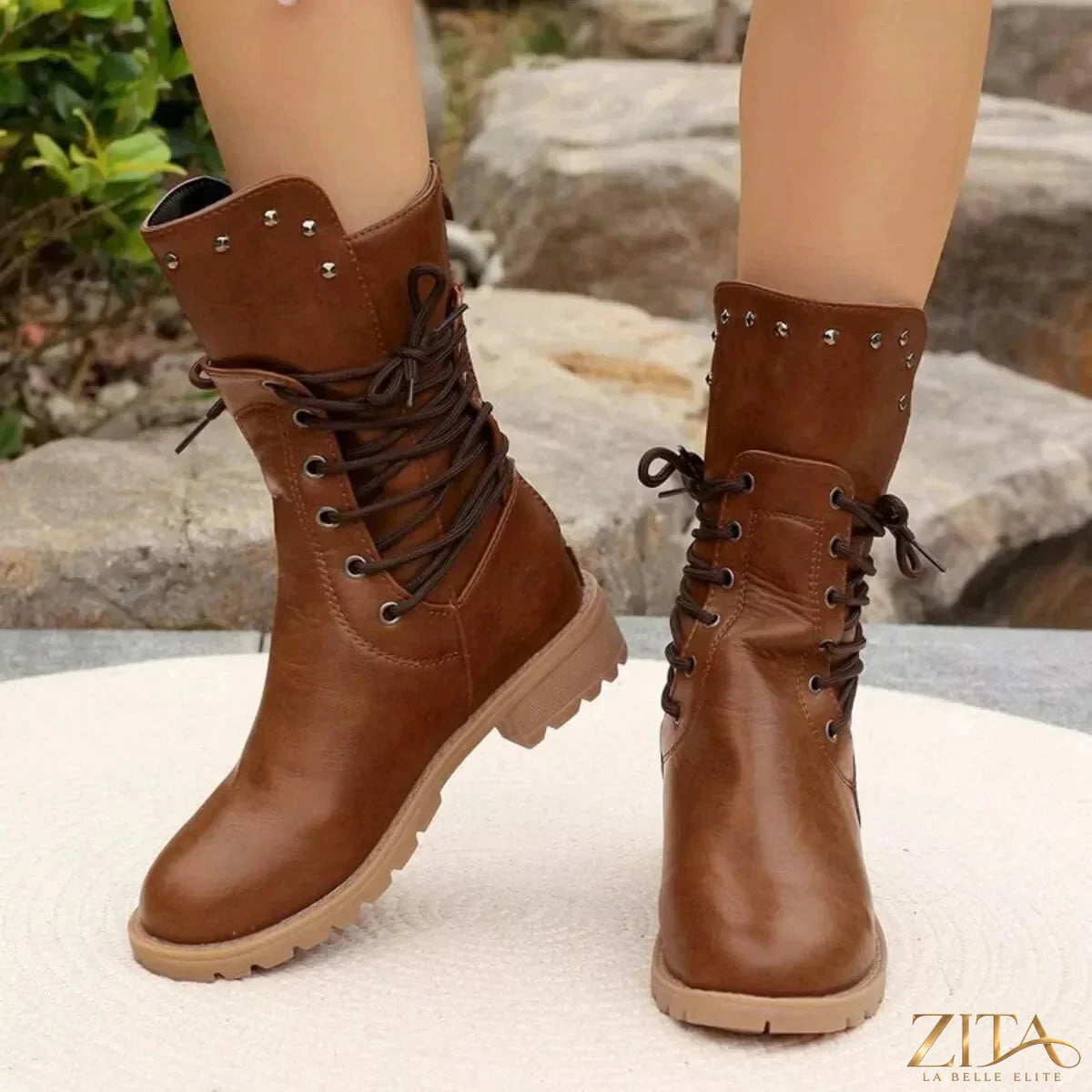 Black studded lace-up boots by Trendsi featuring chunky heels and metal detailing, perfect for edgy fashion styles.