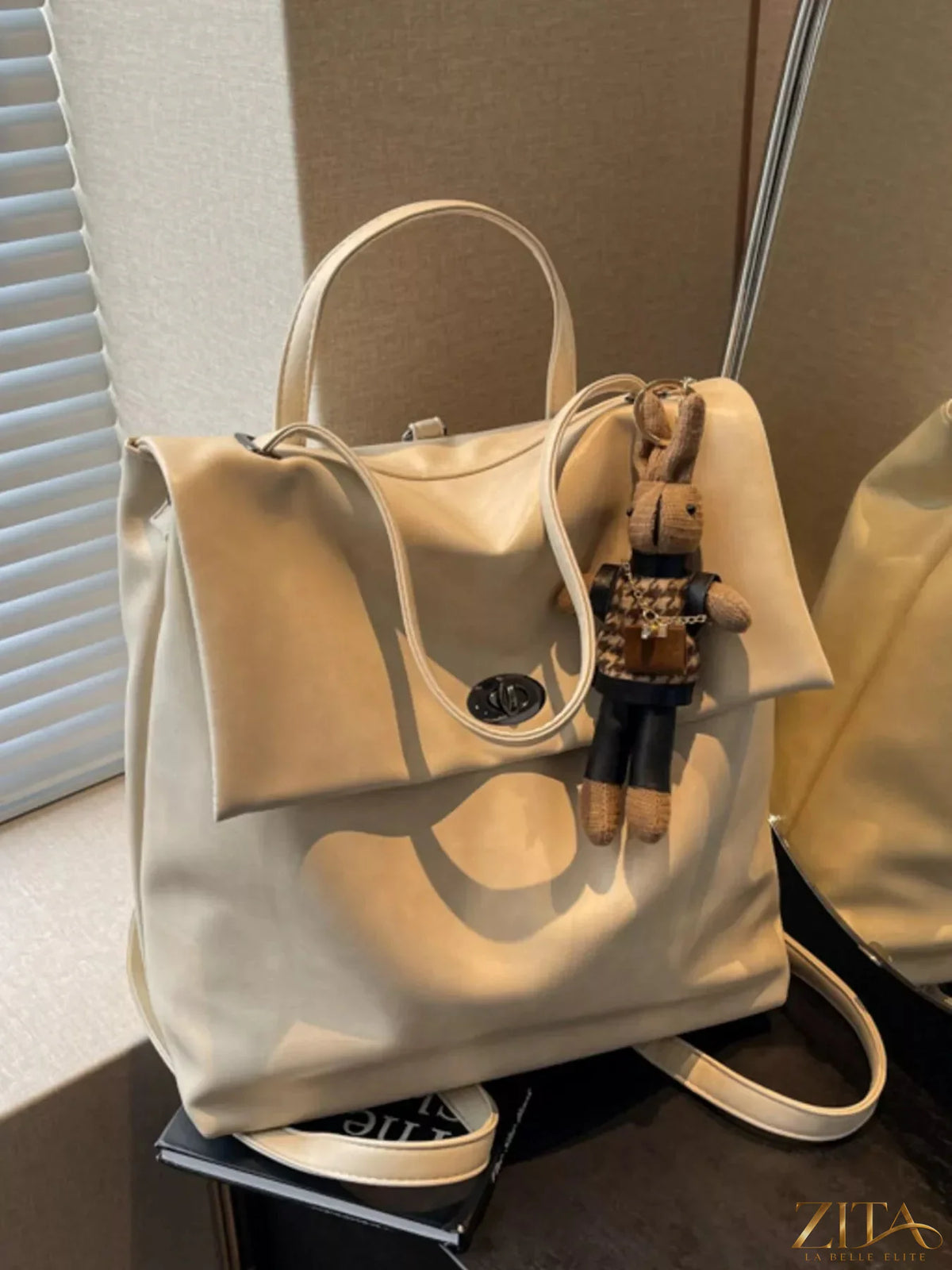 Leather flap backpack bag by Trendsi featuring a sleek design, adjustable straps, and a front flap closure for everyday use.