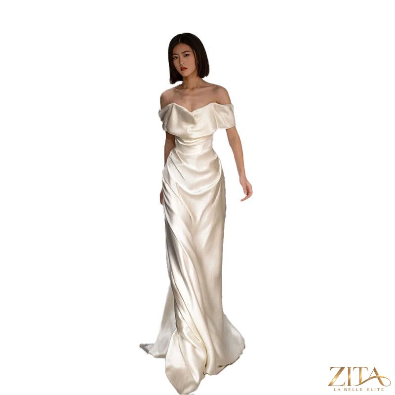 Elegant French white off-shoulder wedding dress for women by Zita La Belle Elite, featuring a light and flowing design.