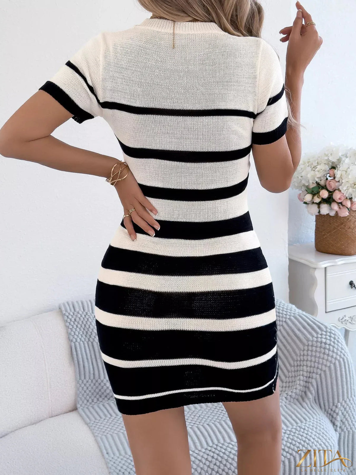 Striped bodycon knit mini dress by Trendsi, featuring a fitted silhouette and bold stripe pattern, perfect for stylish casual wear.