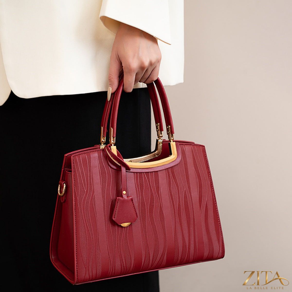 Crocodile embossed leather top handle handbag by Zita La Belle Elite, featuring structured design and gold-tone hardware.