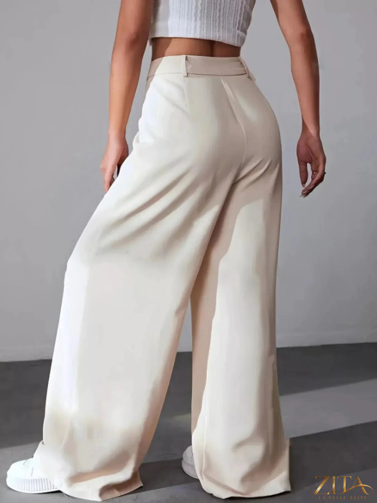 Wide leg pleated pants by Zita La Belle Elite, featuring flowing fabric and high waist design, shown in a stylish, full-length view.