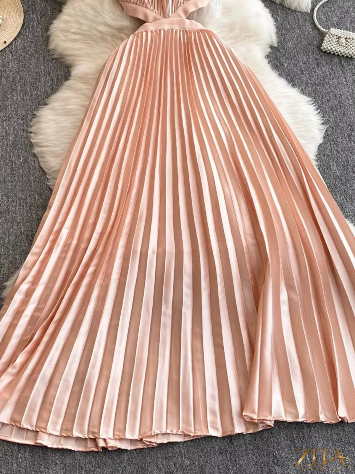 Zita La Belle Elite halter neck pleated maxi dress in flowing fabric, featuring a fitted waist and elegant design.