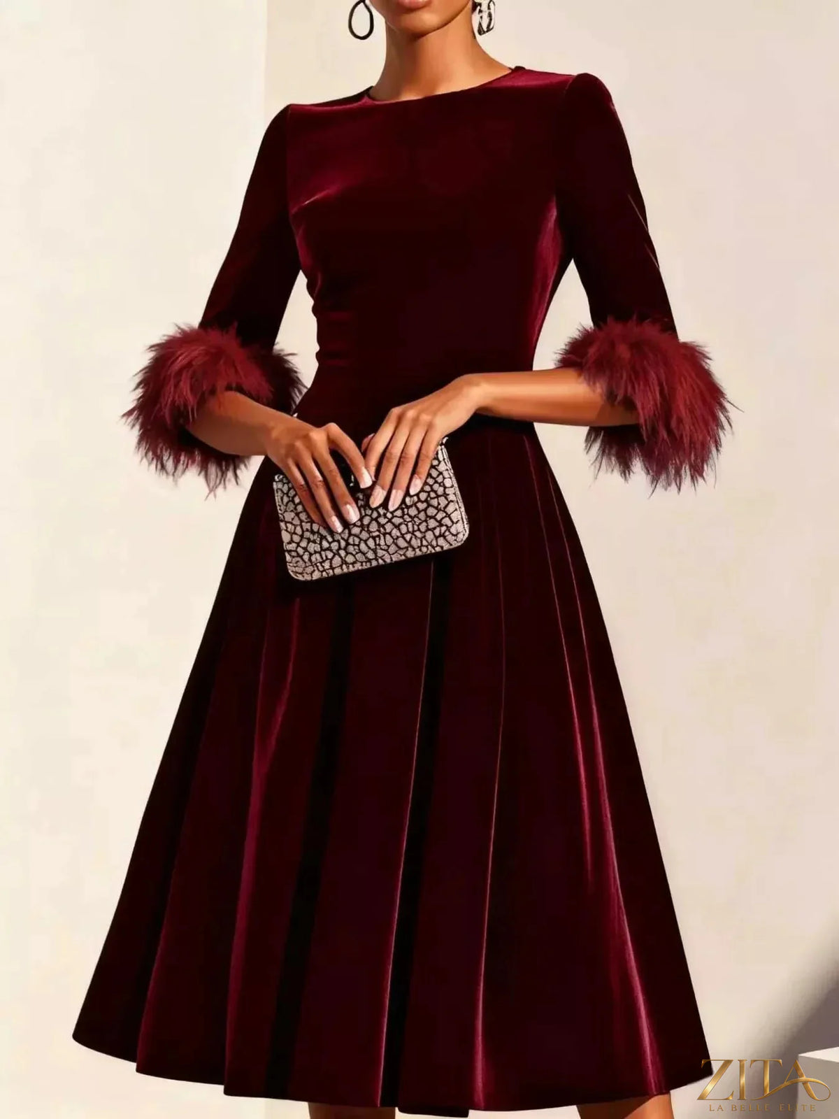 Velvet midi dress by Zita La Belle Elite featuring feather cuffs and a sleek, elegant design perfect for formal occasions.