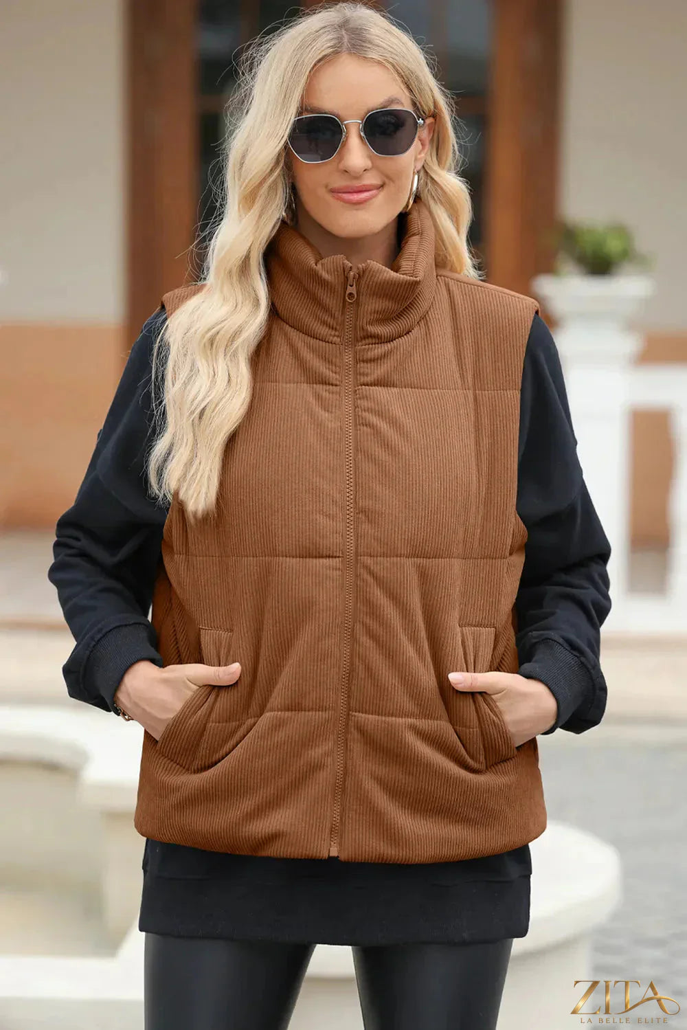Trendsi pocketed zip-up turtleneck vest coat showing a fitted black design with front pockets and a zip closure.