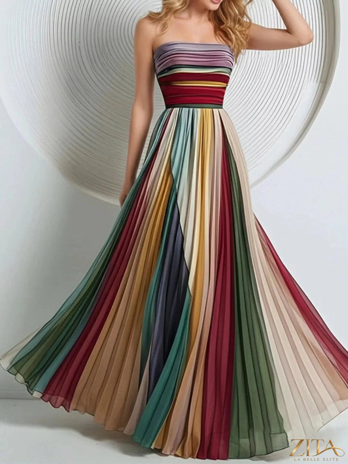 Zita La Belle Elite striped pleated tube maxi dress with vertical blue and white stripes, flowing fabric, and fitted bodice.
