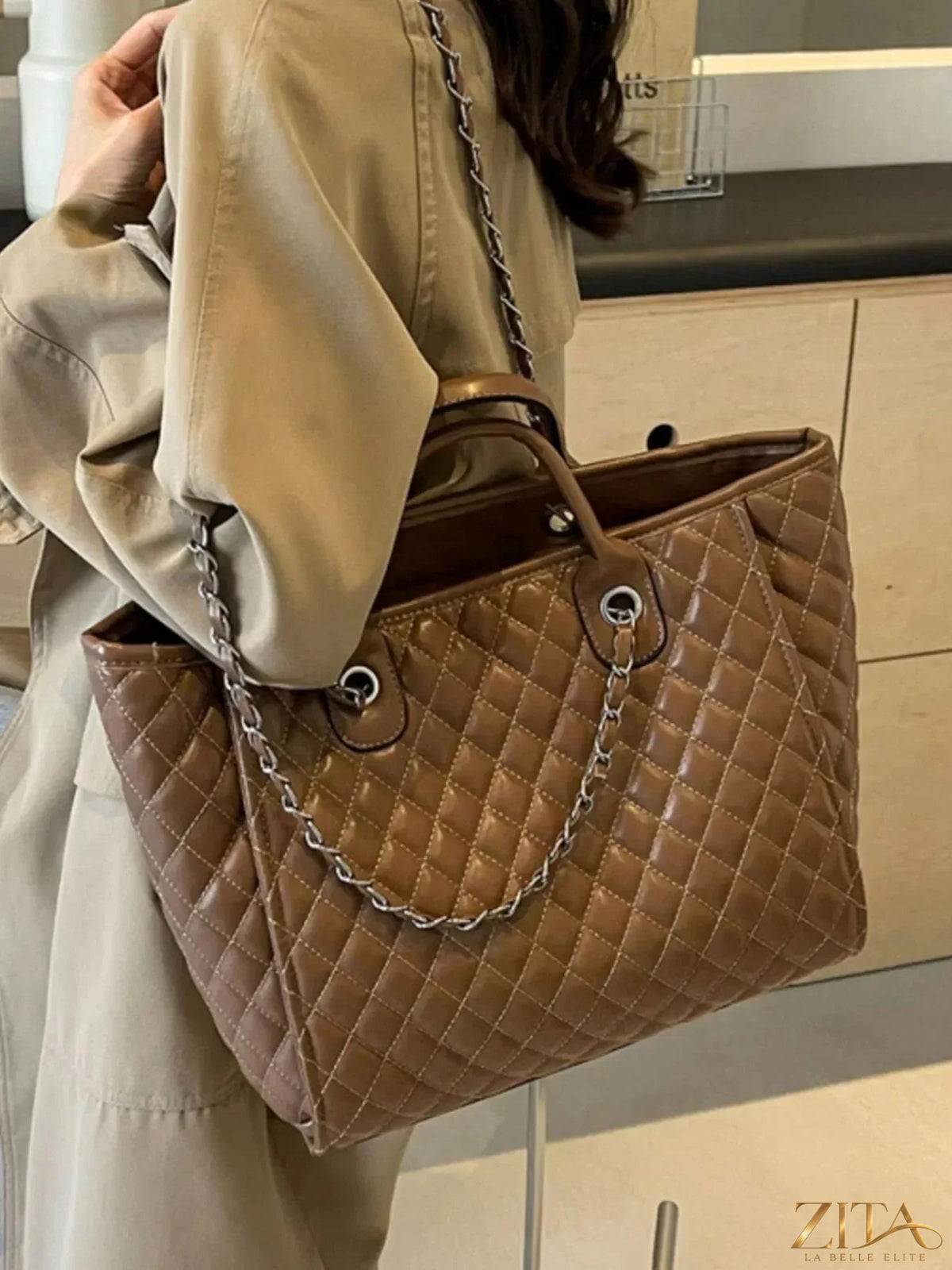 Zita La Belle Elite quilted chain shoulder bag with top handle and silver chain strap, stylish designer accessory.