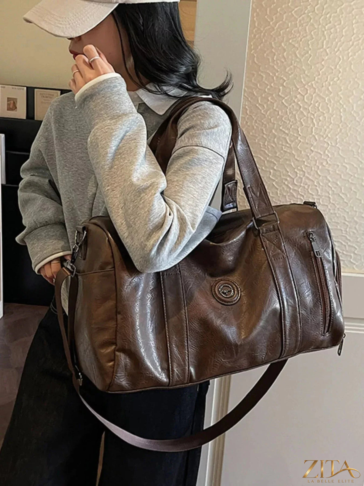 Trendsi PU leather duffel bag with sturdy handles and spacious interior, ideal for travel or gym use.