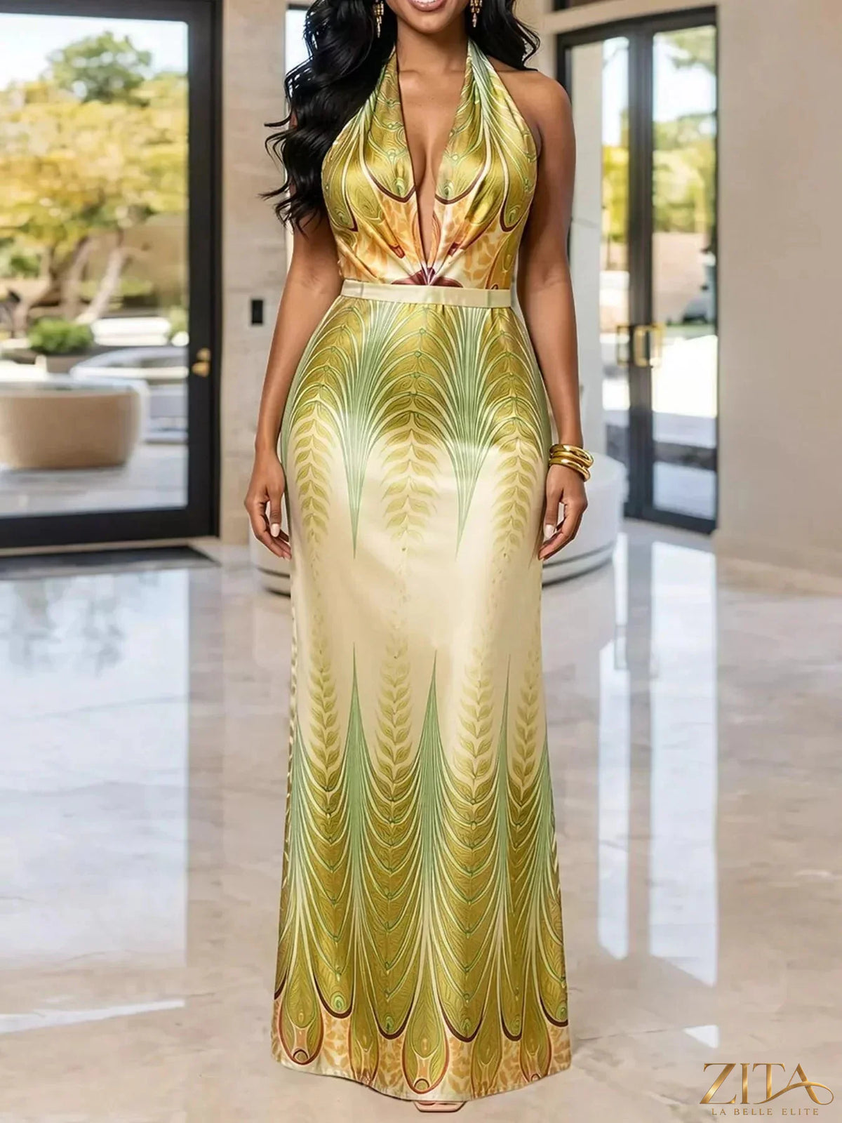 Elegant Zita La Belle Elite halter neck maxi dress with a gradient leaf print, flowing fabric and stylish design.