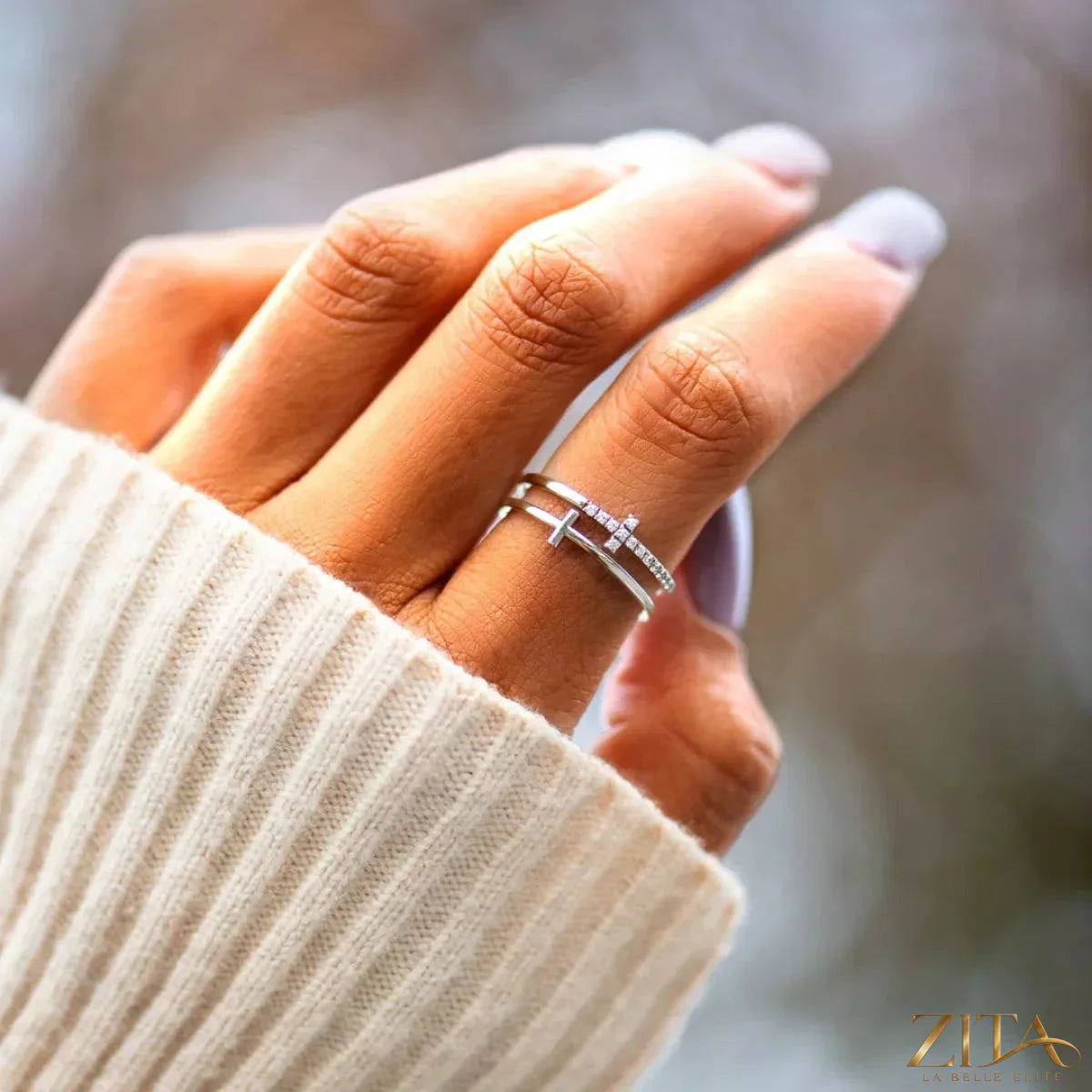 Double band cross ring by Zita La Belle Elite, featuring intertwined silver bands with a cross design for elegant jewelry.