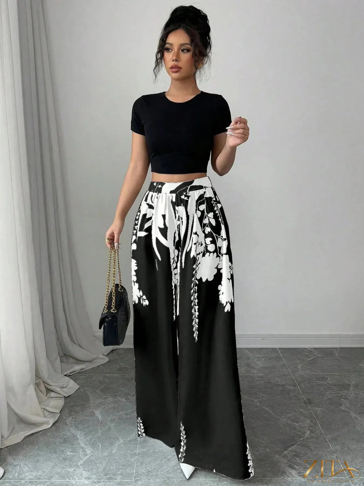 Zita La Belle Elite printed wide-leg pants with colorful floral pattern, flowing fabric, and relaxed fit.