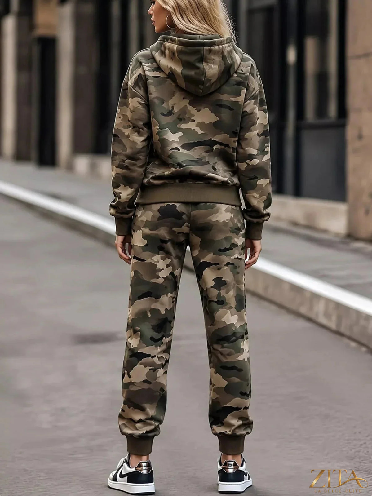 Camouflage print hoodie and joggers two-piece set by Trendsi, featuring matching camouflage design and comfortable fit.