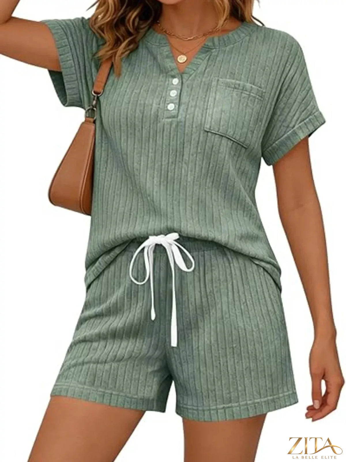 Casual ribbed knit tee and shorts set by Trendsi, featuring a comfortable, stylish matching top and bottoms in neutral tones.