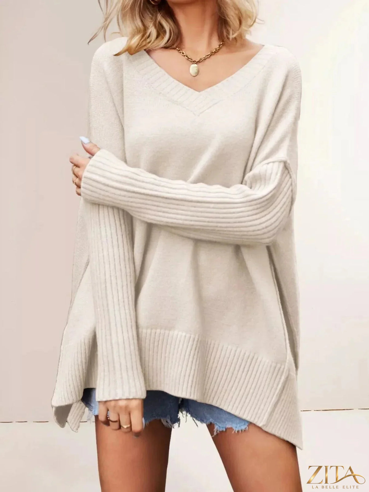 Zita La Belle Elite V-neck ribbed sleeve sweater in soft knit fabric, featuring a fitted V-neck and ribbed sleeve details.