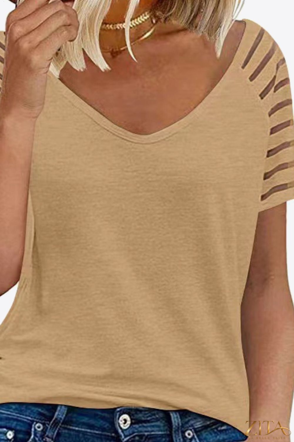 V-neck raglan sleeve tee from Trendsi, featuring a casual fit with contrasting sleeve colors and a classic neckline.