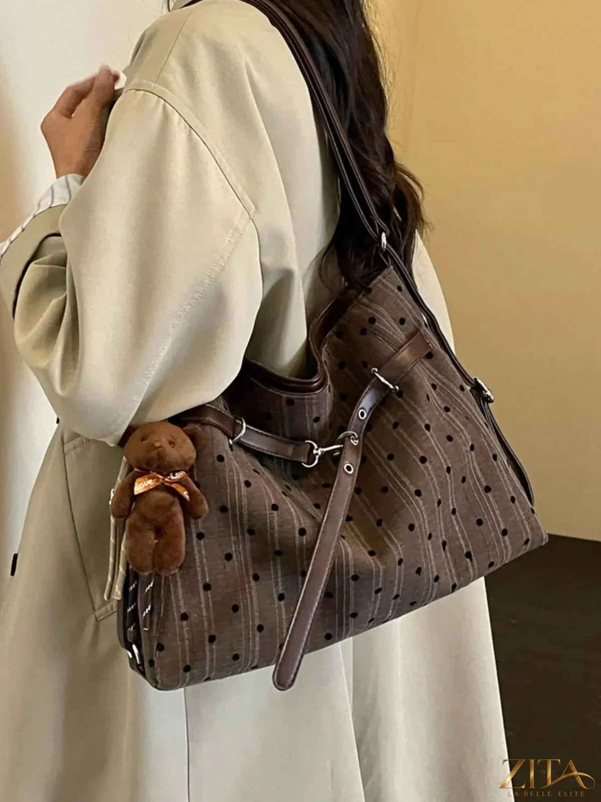 Polka dot Zita La Belle Elite shoulder bag with adjustable strap and stylish design, featuring a charming polka dot pattern.
