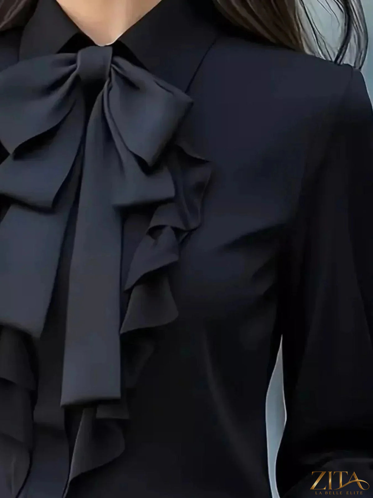 Zita La Belle Elite ruffled tie front long sleeve blouse with feminine details and soft fabric, shown in a stylish fashion image.