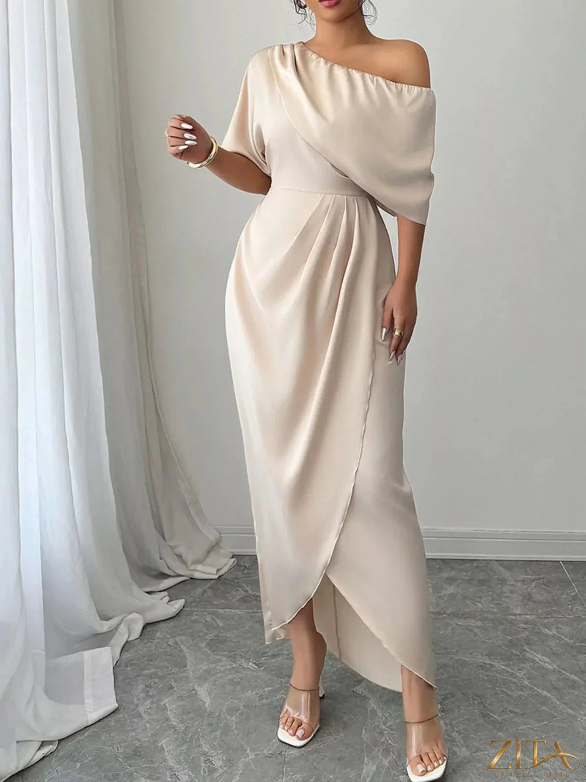 Elegant one-shoulder satin maxi dress from Trendsi with draped neckline and flowing skirt, perfect for formal occasions.