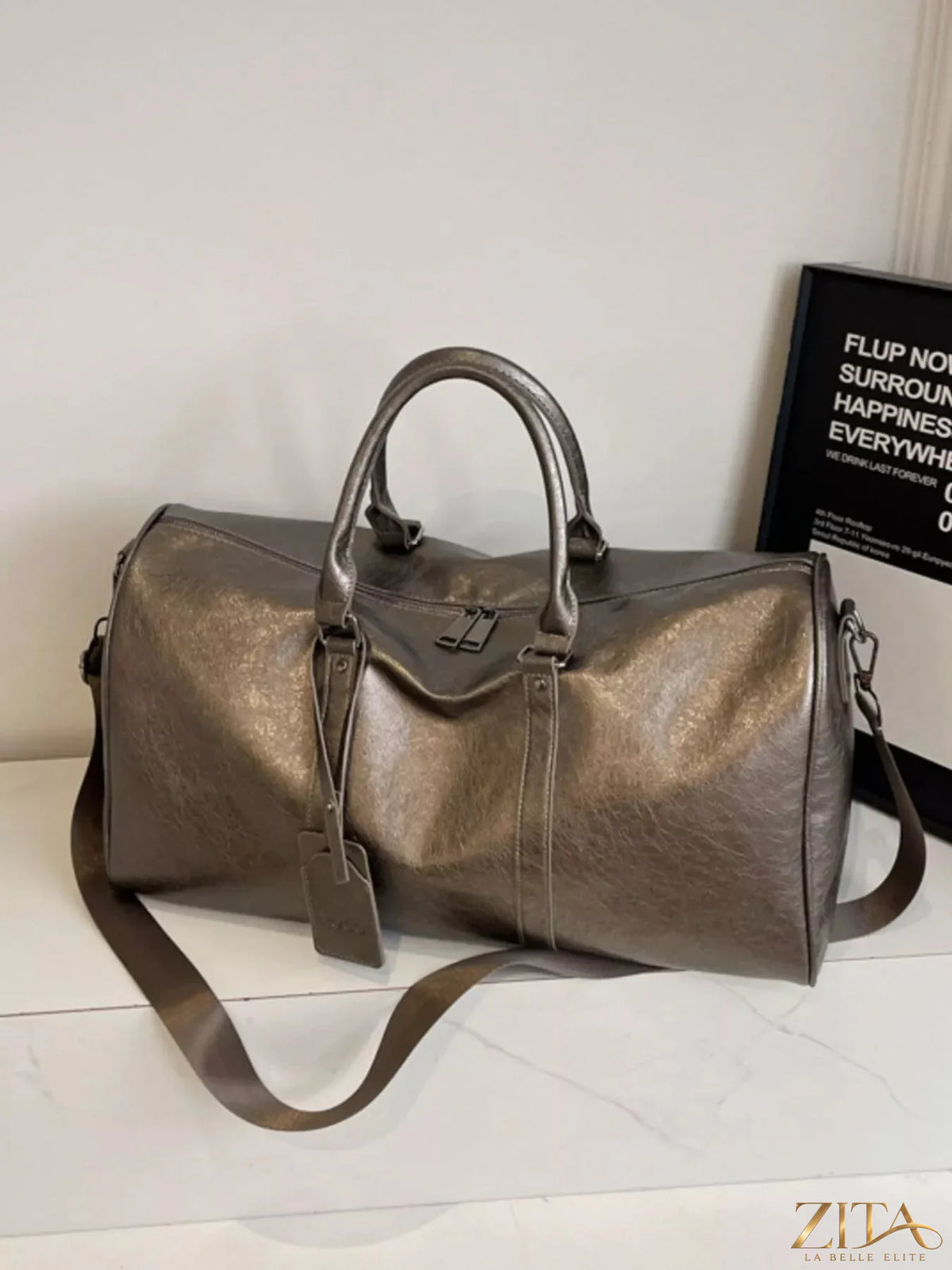 Trendsi PU leather duffle bag with sturdy handles and zipper closure, showcasing its sleek, spacious design for travel or gym use.