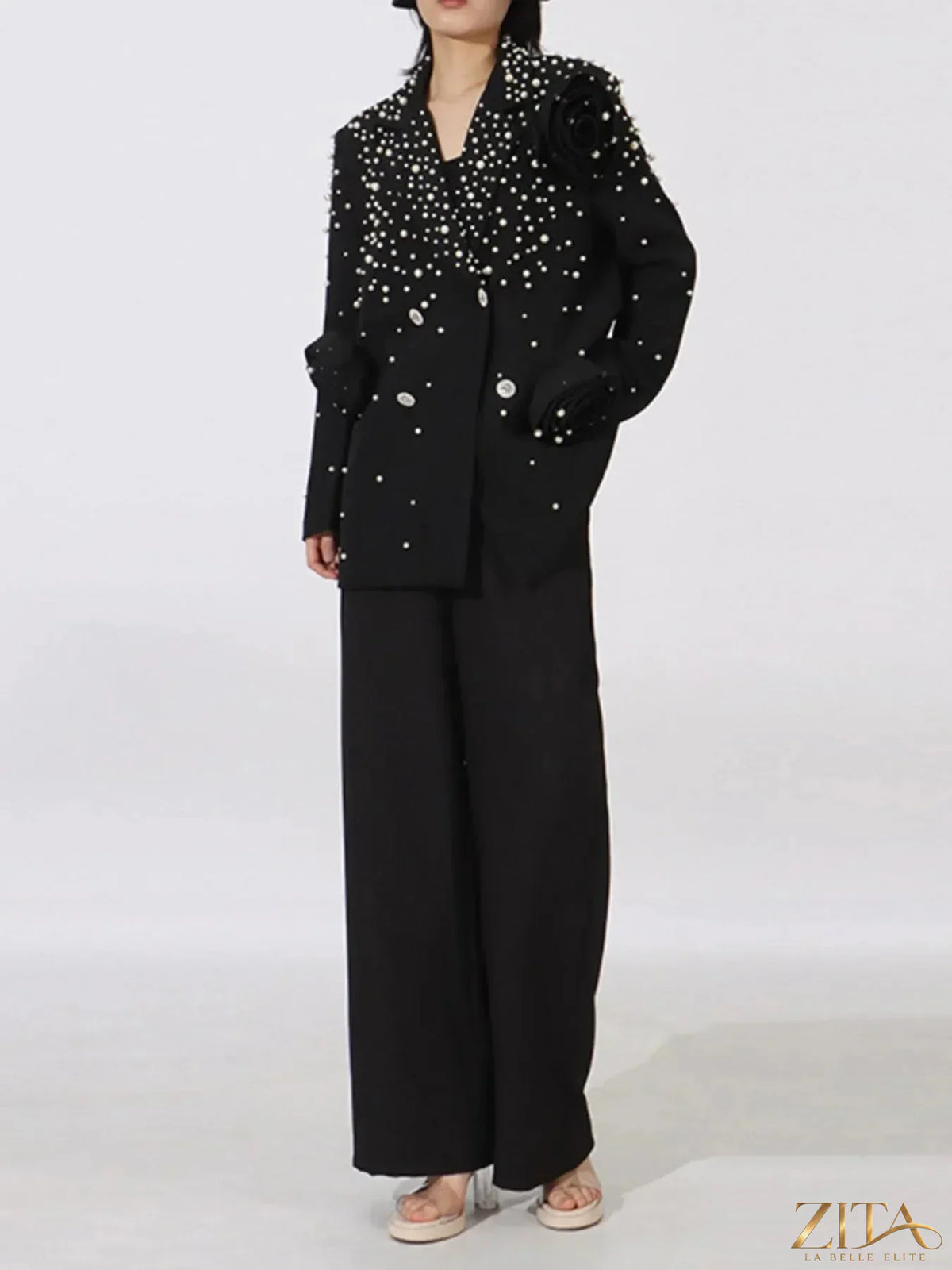 Pearl-embellished double-breasted blazer from Trendsi, featuring a tailored fit and elegant design with pearl accents.