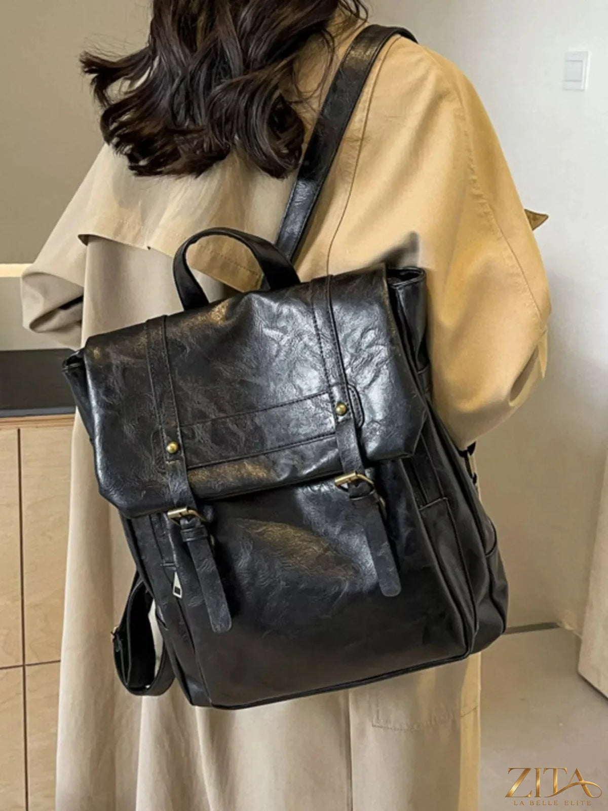 Leather flap backpack bag by Trendsi featuring a stylish design with adjustable straps and a spacious main compartment.