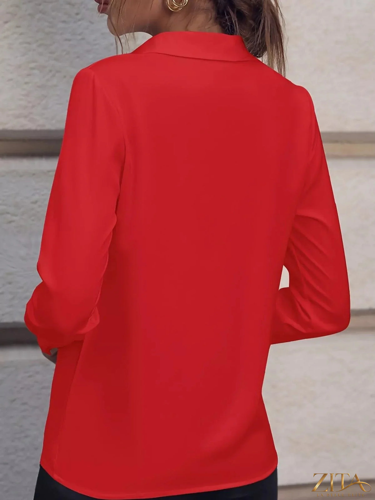 Zita La Belle Elite long sleeve satin blouse in soft, glossy fabric, displayed on a hanger with a neutral background.