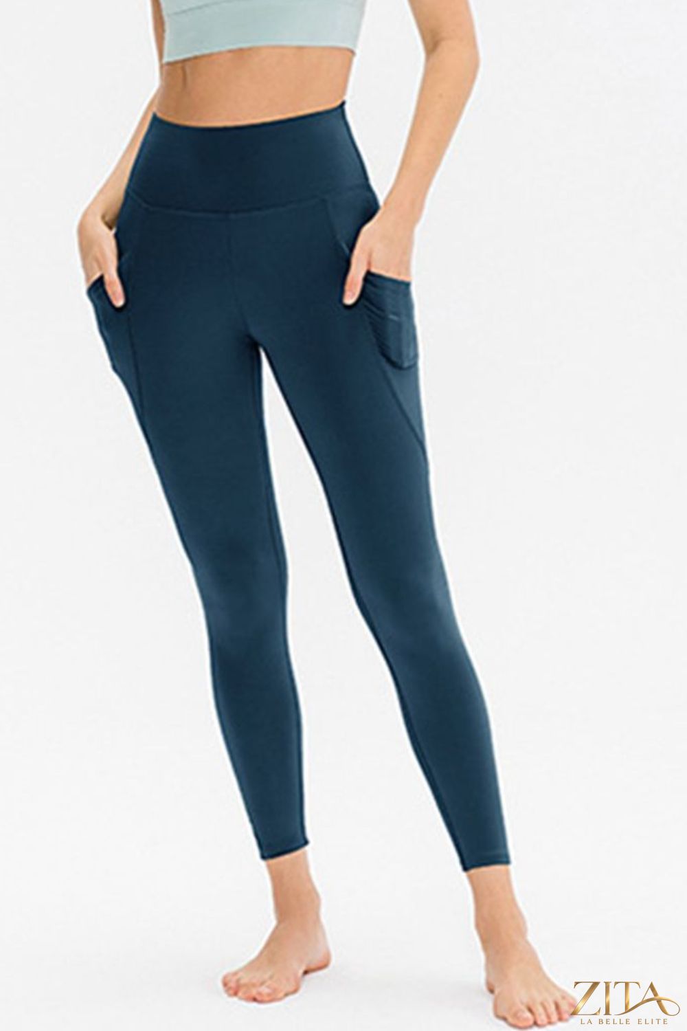Slim fit long active leggings with pockets from Trendsi, shown in black, designed for comfortable workout and casual wear.