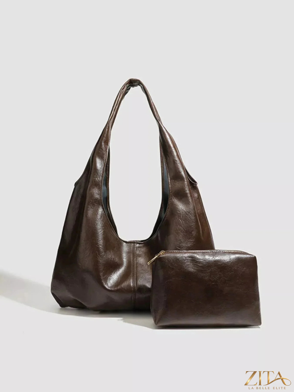 Vintage glossy hobo shoulder bag with matching pouch by Zita La Belle Elite, featuring a sleek design and stylish craftsmanship.