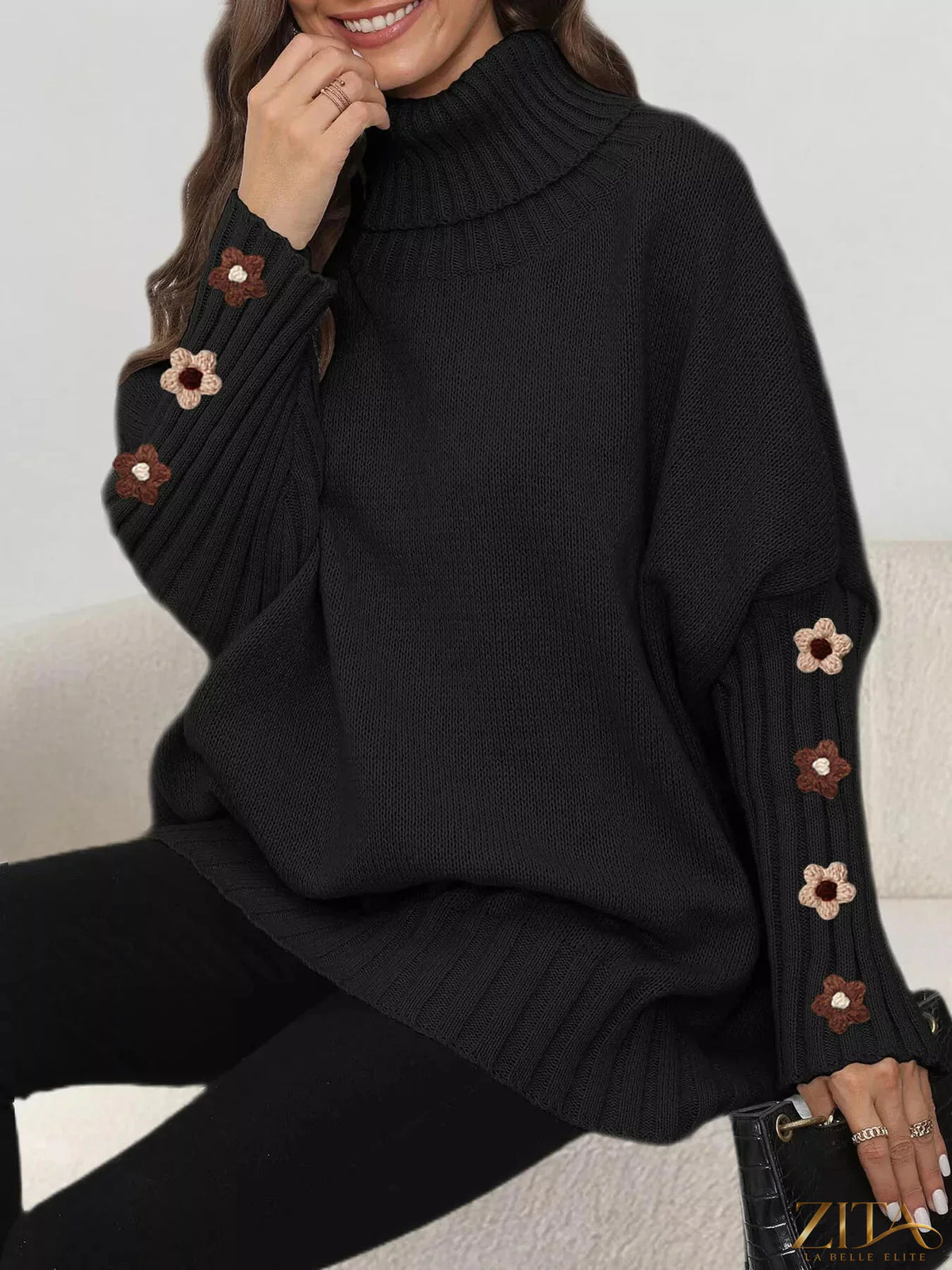 Zita La Belle Elite oversized turtleneck sweater with floral applique sleeves, cozy knit design and stylish floral accents.