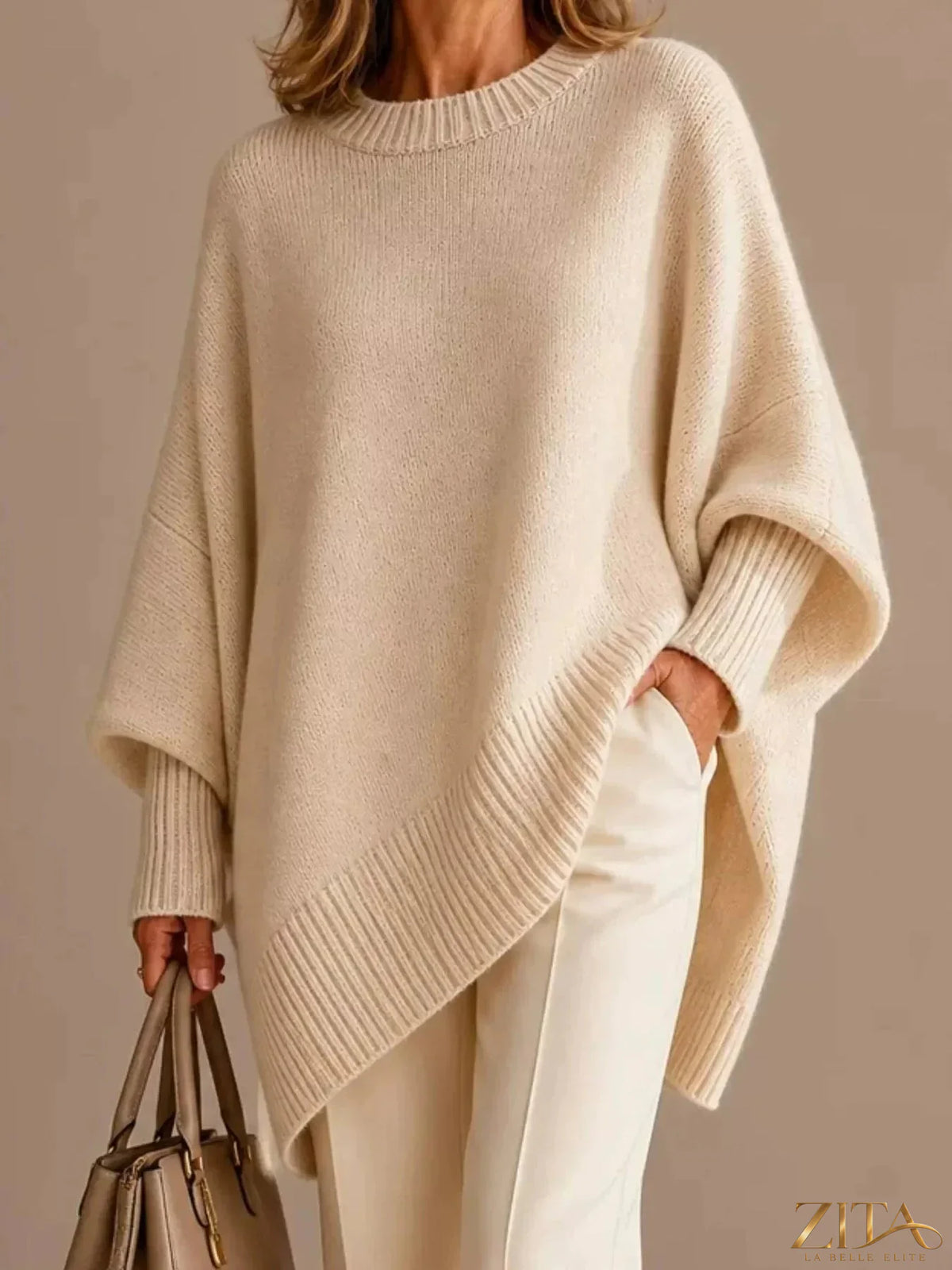Oversized dropped shoulder sweater by Trendsi featuring a cozy knit design in neutral tones.