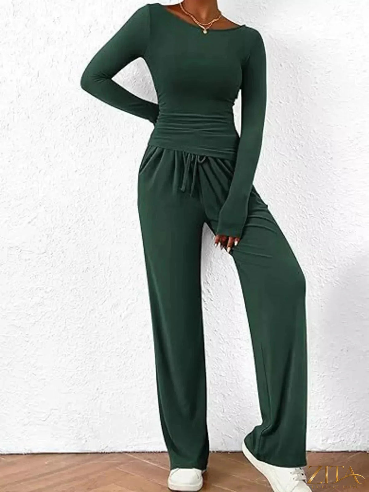 Zita La Belle Elite long sleeve top and wide-leg pants set in soft fabric, displayed on a hanger against a neutral background.