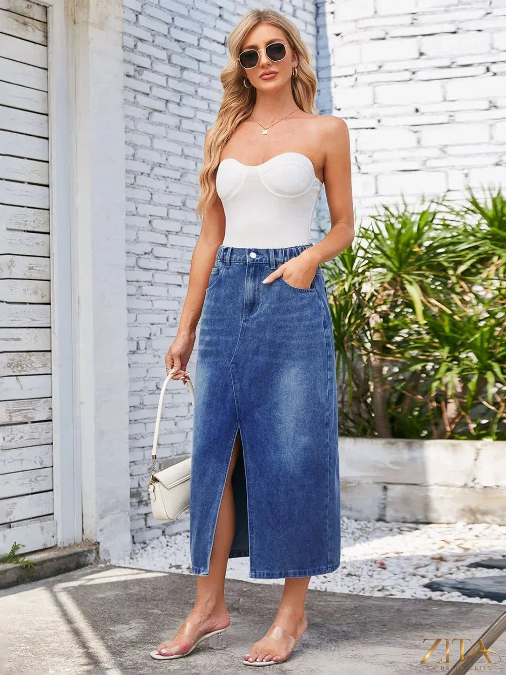 Zita La Belle Elite slit midi denim skirt with pockets, featuring a stylish cut and classic blue denim fabric.