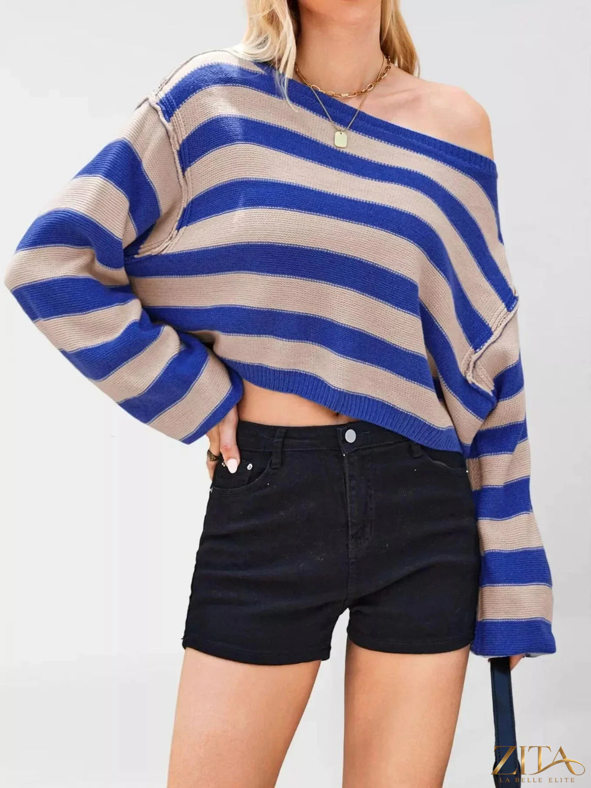 Striped boat neck sweater by Trendsi featuring a classic design with horizontal navy and white stripes, long sleeves, and a relaxed fit.