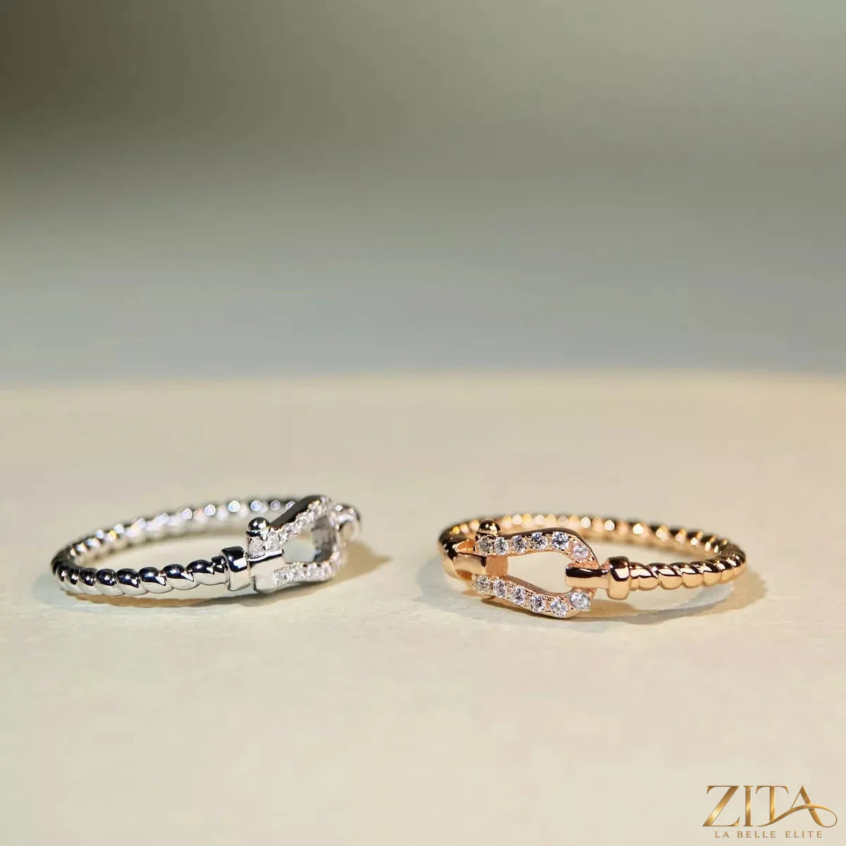 Sterling silver horseshoe-shaped ring with zircon stones by Zita La Belle Elite, showcasing a detailed, elegant jewelry design.